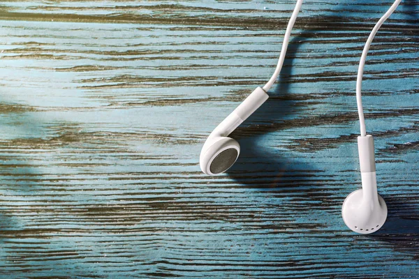 Headphones on wooden table — Stock Photo, Image