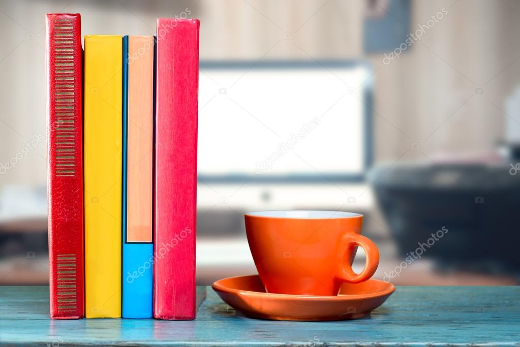 Books and cup on desk
