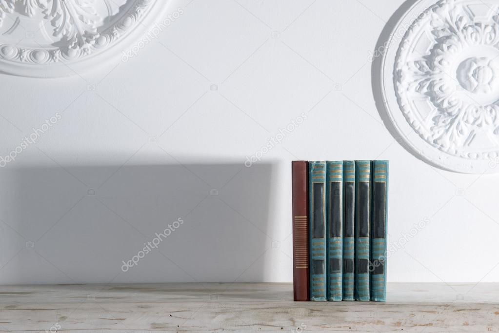 Books on wooden shelf