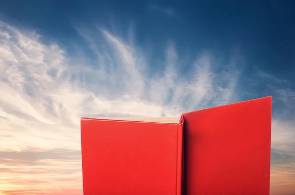 Red Book against sky landscape — Stock Photo, Image