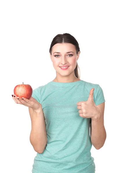 Mujer sosteniendo manzana mostrando el pulgar hacia arriba —  Fotos de Stock