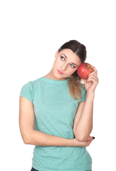 Chica con una manzana mirando hacia arriba —  Fotos de Stock