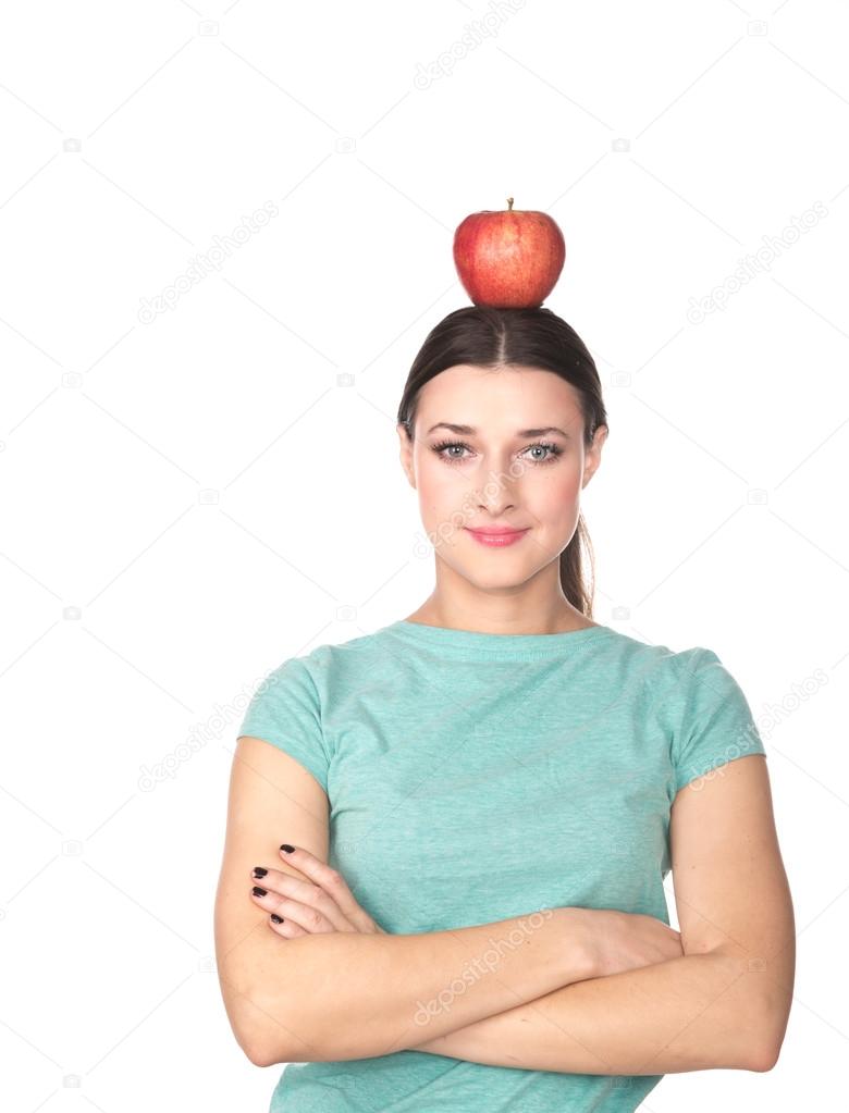 woman holding an apple on head
