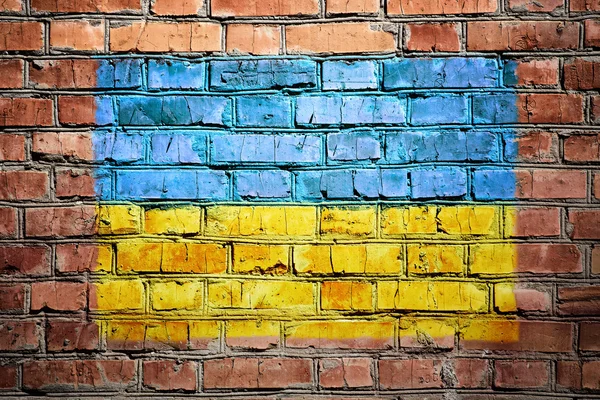 Drapeau ukrainien sur le mur de briques — Photo