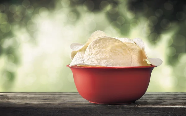 Potato chips on table — Stock Photo, Image