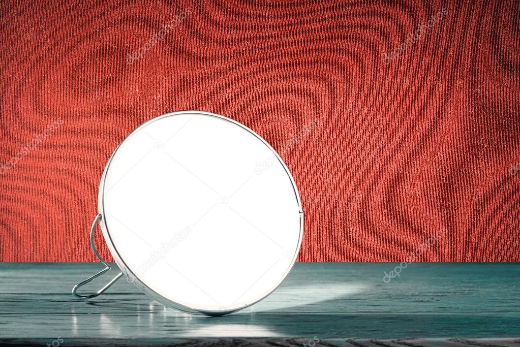 Mirror on wooden table