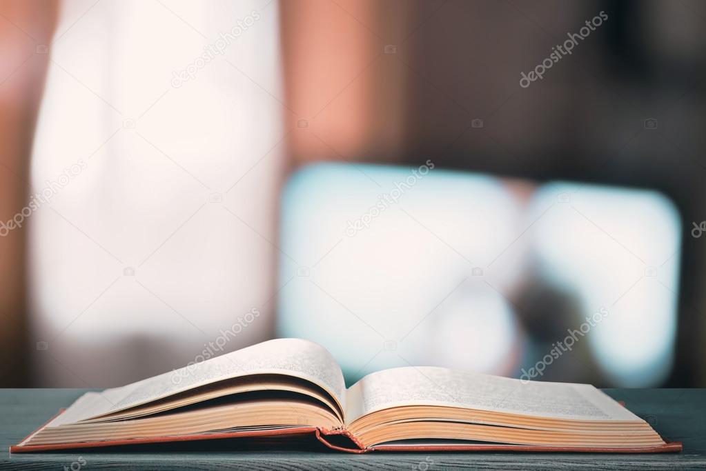 Opened book on table