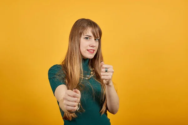 Angry and aggressive, shaking fist in a threatening way, domestic violence Stock Photo