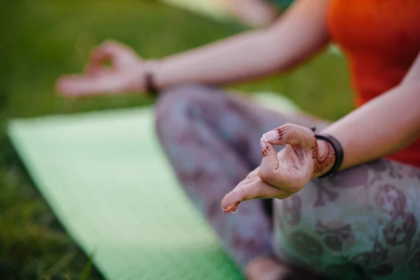 Close-up of the hands of a young girl who does yoga. Healthy lifestyle