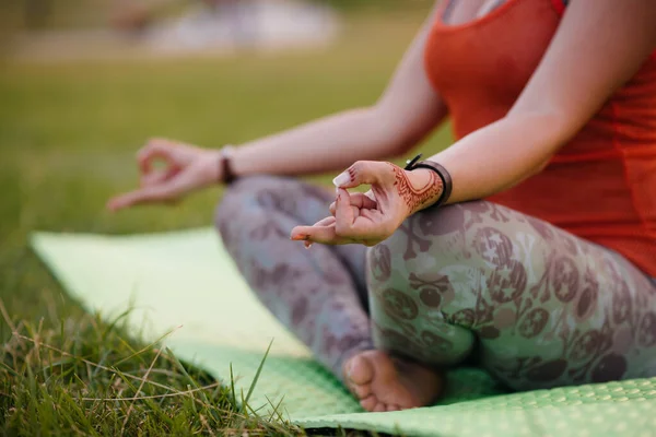 Close-up of the hands of a young girl who does yoga. Healthy lifestyle