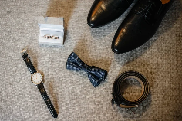 Stylish men\'s accessories close-up during the preparations for the wedding