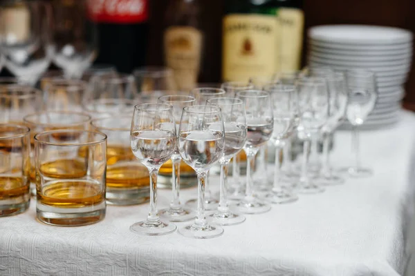 Festive glasses on the festive table during the Banquet. Alcoholic beverage