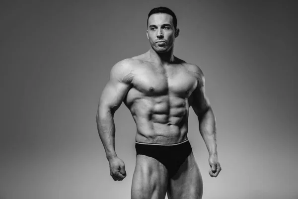 Young Athlete Bodybuilder Poses Studio Topless Showing His Abs Muscles — Stock Photo, Image