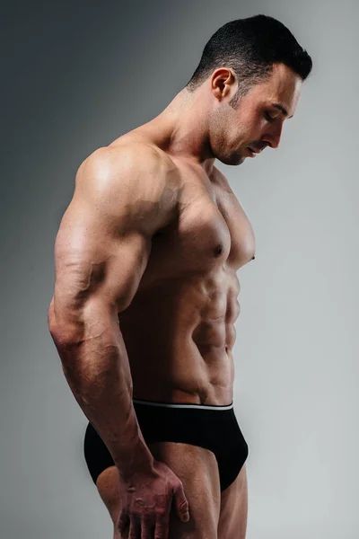 Young Athlete Bodybuilder Poses Studio Topless Showing His Abs Muscles — Stock Photo, Image