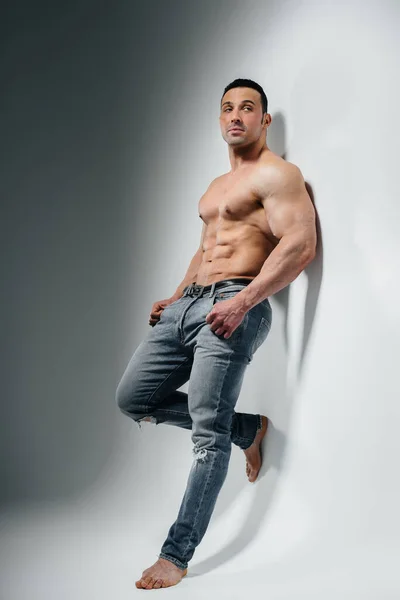 Young Athlete Bodybuilder Poses Studio Topless Jeans Wall Sport — Stock Photo, Image