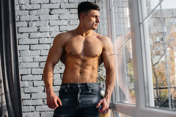 Young Sexy Athlete Perfect Abs Poses Window Studio Topless Jeans — Stock Photo, Image