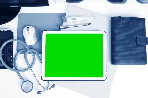 Digital Tablet Showing Green Screen Doctor Desk — Stock Photo, Image