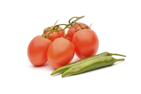 Tomatoes and hot chilli on white background — Stock Photo, Image