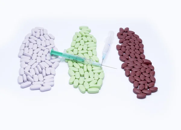 Medicine pills with syringe — Stock Photo, Image