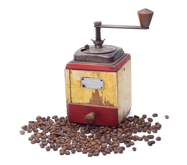 Vintage coffee grinder with coffee beans — Stock Photo, Image