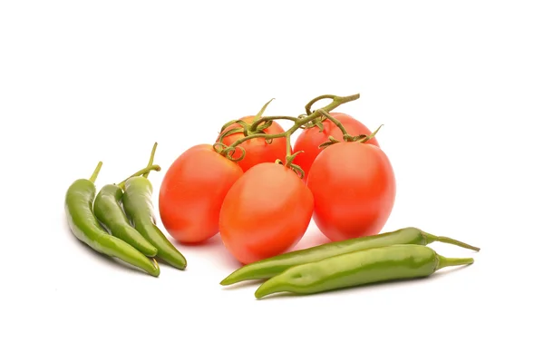 Tomatoes and hot chilli on background — Stock Photo, Image