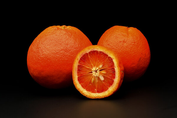 Orange fruit on black blackground