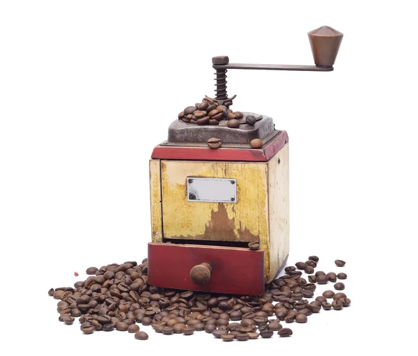 Vintage coffee grinder with coffee beans — Stock Photo, Image