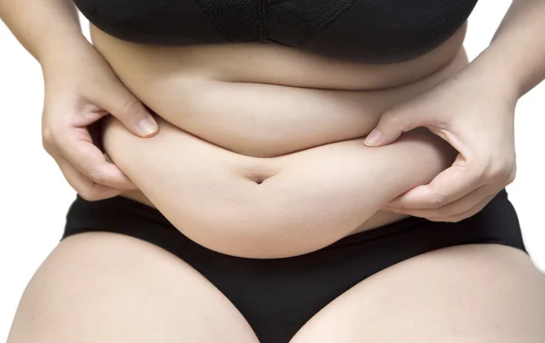 Mulher espremer gordura da barriga vestindo sutiã roupa interior preta e calça em branco isolado — Fotografia de Stock