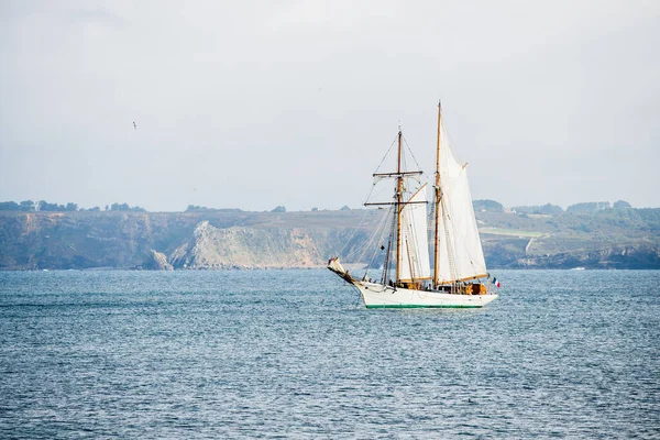 French tall ship with full sails at the coast of Brittany, France