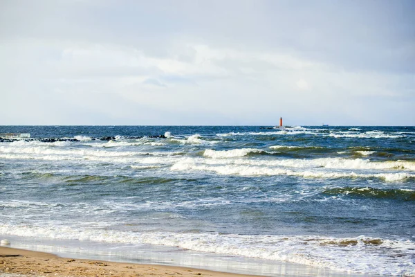 Cold stormy waves and clouds over the North sea, Netherlands