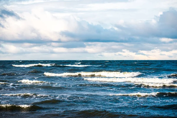 Cold stormy waves and clouds over the North sea, Netherlands