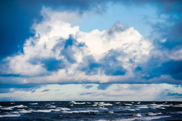 Cold stormy waves and clouds over the North sea, Netherlands