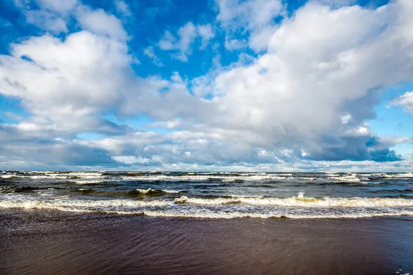 Cold stormy waves and clouds over the North sea, Netherlands