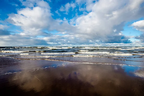 Cold stormy waves and clouds over the North sea, Netherlands