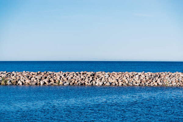 Clear blue sunset sky above the shores of the Baltic sea. A view from the pier. Ruhnu island, Estonia