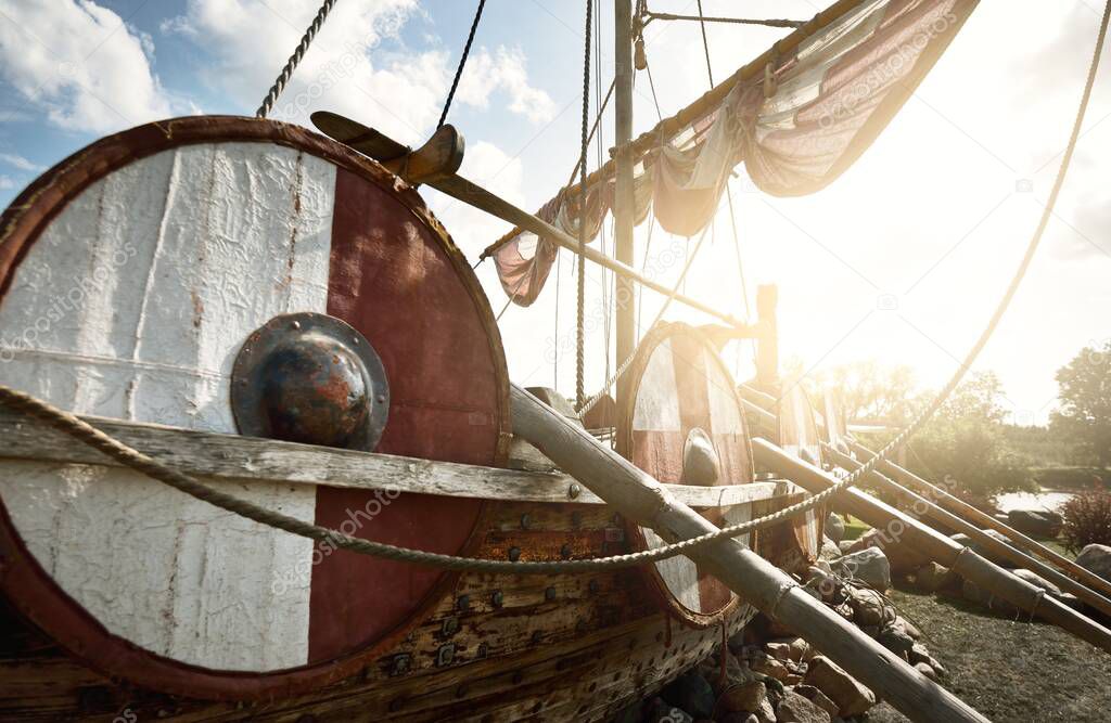 Old wooden viking snekkja longship type, close-up. Nautical vessel, tall ship, traditional craft, vintage, landmark, history, past, historical reenactment, nordic culture
