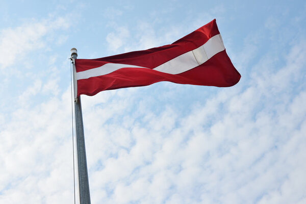 Flag of Latvia on a flagpole