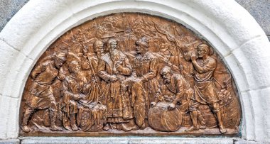 The northern bas-relief introduces the life of ancient Vologda. The famous bargaining at the wooden church of the Resurrection of Christ is depicted. Fragment of the monument to the 800th anniversary of Vologda. Vologda. Russia. Aug 3, 2018