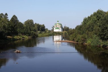 The Olonka River and the Church of the Smolensk Icon of the Mother of God on the island of Mariam. Olonets. Karelia. Russia.Date of capturing Aug 4, 2013