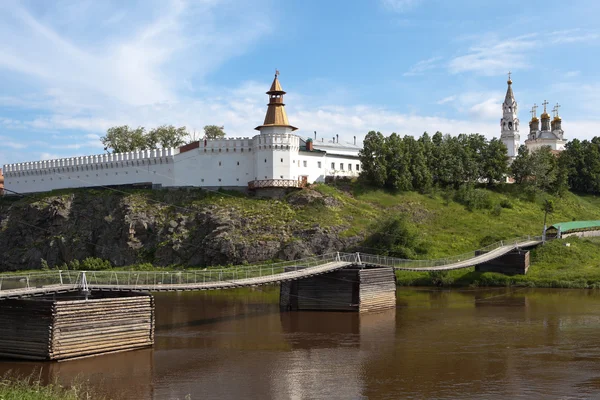Bridge on the River Tour and Verkhotursky Kremlin with Trinity Cathedral. Verkhoturye. Obrazek Stockowy
