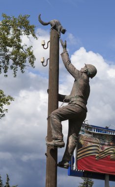 VELIKY NOVGOROD, RUSSIA -  AUGUST 02, 2015: Photo of Monument electrician, rescues cat.