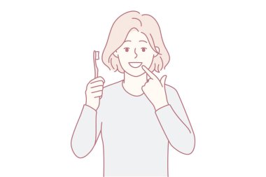 Gülümseyen kız diş fırçasıyla beyaz dişlerini gösteriyor. Mutlu çocuk diş fırçalama ve oral bakım öneriyor. Diş bakımı konsepti. Vektör illüstrasyonu.