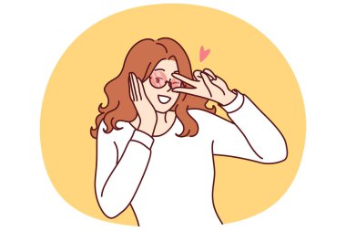 Cilveli kadın, hoşlandığı yoldan geçeni baştan çıkarmak ya da onunla tanışmak için göz kırpıyor. Coquettish genç kız erkek arkadaşının dikkatini çekmek için jestler yapar ve telefon görüşmesi ayarlar..