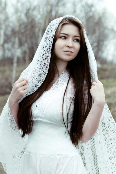 Beautiful innocent woman in white dress — Stock Photo, Image