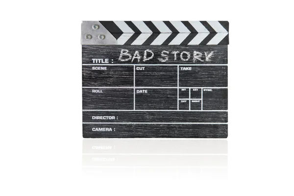 Planche à claquer en bois sur fond blanc Titre Bad story — Photo