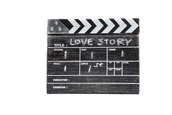 Clapper board in legno su sfondo bianco Titolo Love story Fotografia Stock