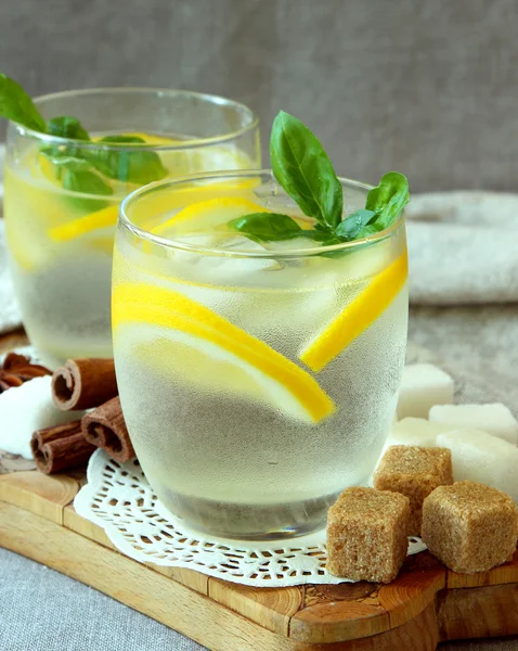 Glasses with cold lemonade and ice cubes. — Stock Photo, Image