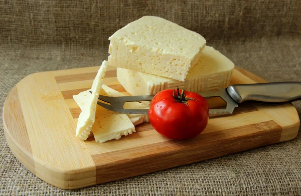 Home cheese, knife and tomato — Stock Photo, Image