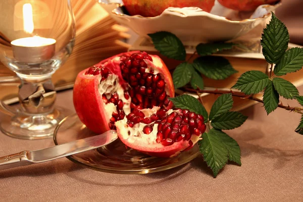 Sliced pomegranate on a plate — Stock Photo, Image