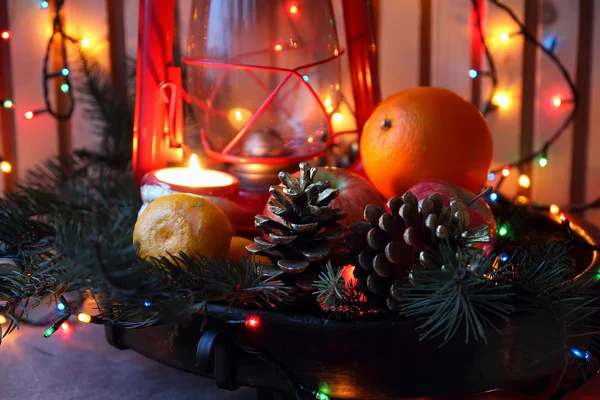 Kegels, orange en kerstboom takken in de samenstelling van het nieuwe jaar — Stockfoto